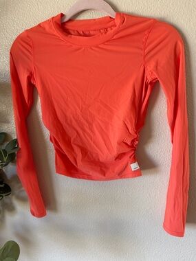 Vuori Women’s Long Sleeve SWIM Top in Coral Orange